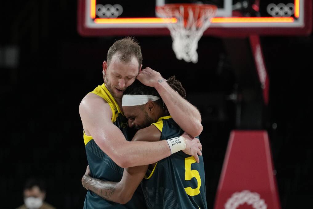 FOUNDATION: Boomers greats Joe Ingles and Patty Mills celebrate bronze. Picture: AAP