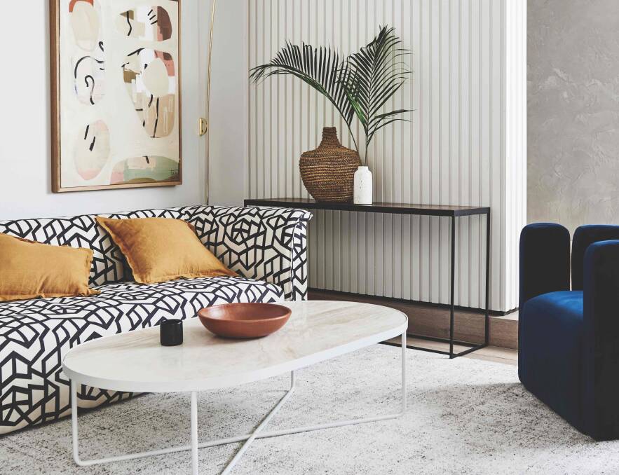 RELAX: To encourage connectivity in a room and promote face-to-face conversation, introduce a striking round or oval coffee table. 