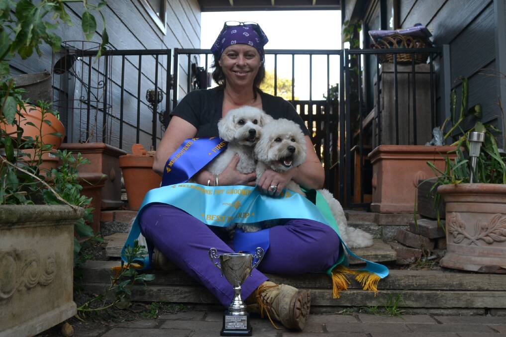 LOOKING SHARP: Dog groomer Corrine Lynch with her pooch Snoopy and Candy Young, who belongs to Shelley, Isabella, Lana and Tahlia. Both dogs were groomed for the championships.