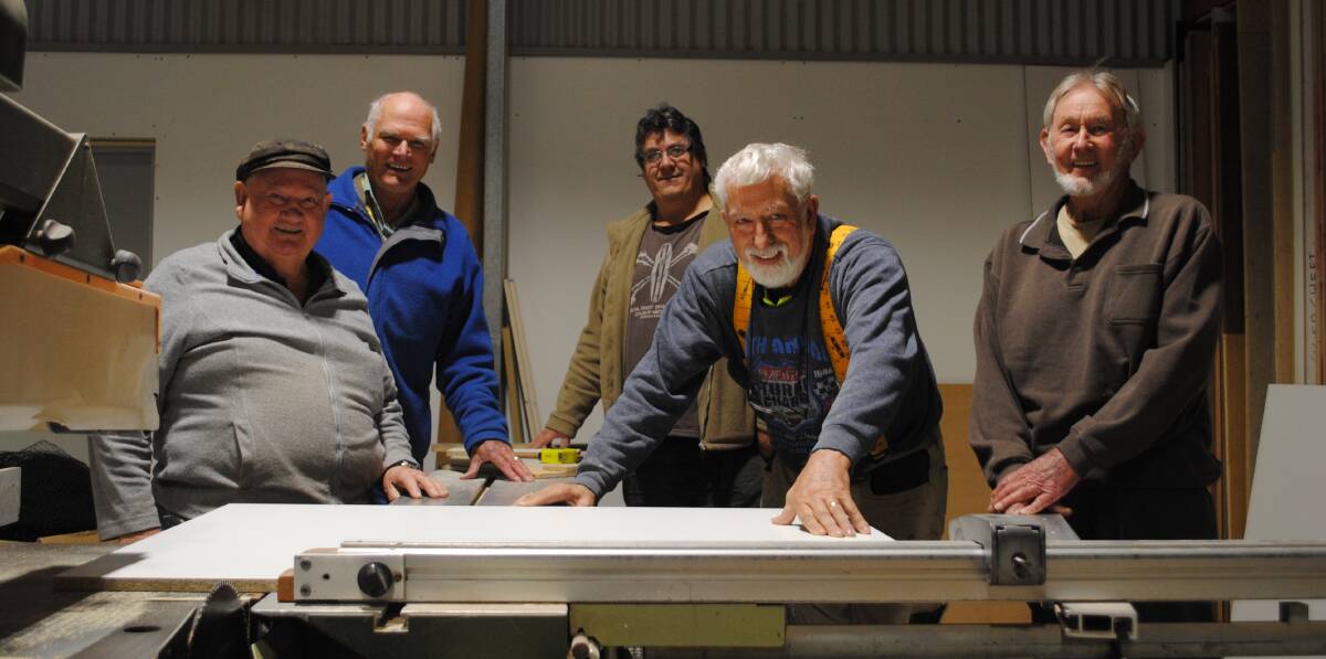 PROUD AS PUNCH: Milton Ulladulla Men's Shed members are putting the final touches on their new premises. 