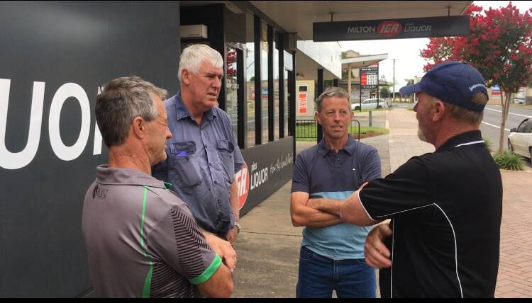 Leon Murray and Michael Ewin talk with Carl Murray and Barney Anderson after receiving a donation from Milton IGA, off the back of the store's price rise. 