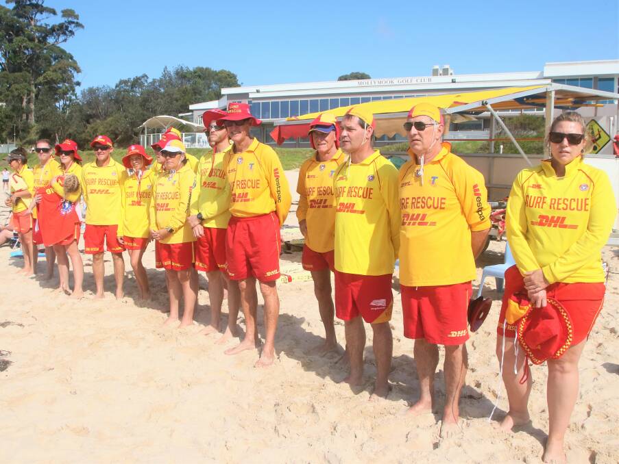 Mollymook Surf Life Saving Club lifesavers honour two Victorian lifesavers with a minutes silence about 12.30pm at Mollymook Beach on Monday, April 22. Picture: Ken Banks.