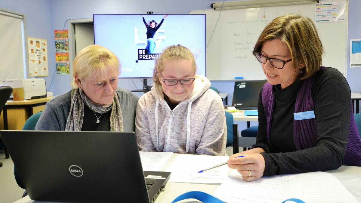 Ulladulla mother and daughter Collette and Taleatha McFarlane sharpen their interview skills with TAFE NSW Ulladulla teacher Sara Eastway. Picture: Adam Wright/TAFE NSW.