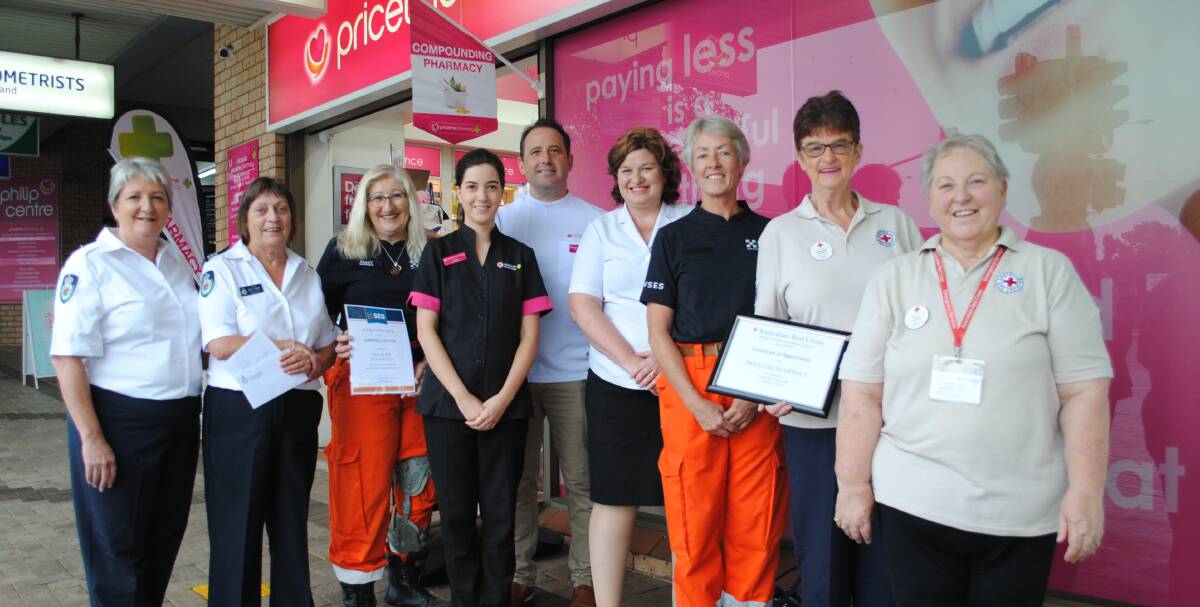 Tabourie RFS secretary Cecily Skennar and captain Diane Heggie, Ulladulla SES Unit commander Tracy Provest, Priceline Pharmacy's Fiona Martin, George Parker and Michelle Campbell, Ulladulla SES member Lee Manning and Red Cross volunteers Margaret Peppitt and Lesley Harper. 