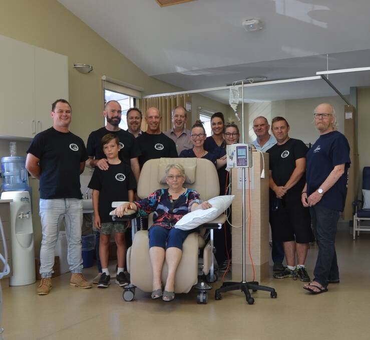 TOGETHER: Mollymook Longboarders, nurses, patient Pam, Medical Head of Department Dr Paul Rothe and the hospital's Director of Nursing Stuart Emslie.