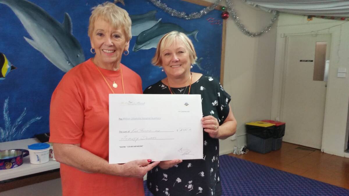Milton Ulladulla Hospital Auxiliary president Judy Bond and Ucki Dean, Co-ordinator, accepting a cheque for $4,070 from the Mollymook Beach Bowlers at the recent Barefoot Bowls Day. Picture: supplied.