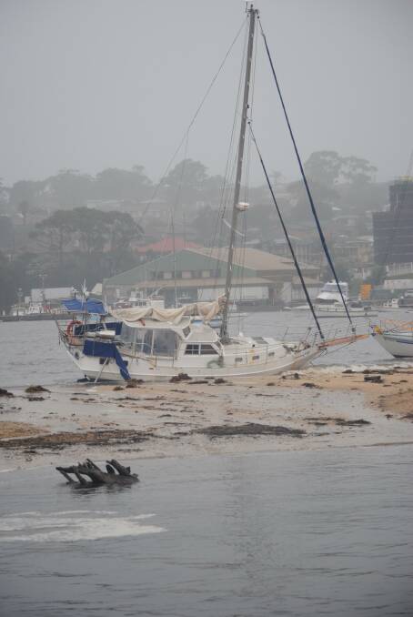 A boat appears to have broken its mooring at Ulladulla Harbour. Picture: Sam Strong.