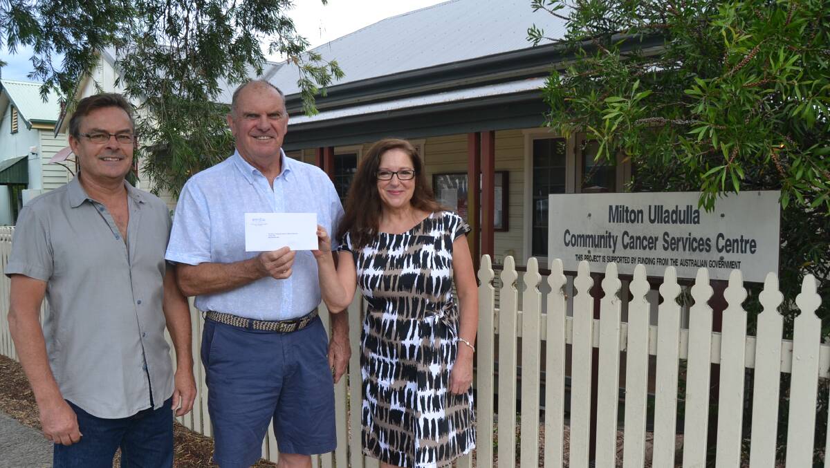 Cancer Outpatients Appeal of Milton Ulladulla representative Peter Still (centre) accepts a donation from Glorious MUDsingers' representatives Philip Cumming and Sarah Ward.