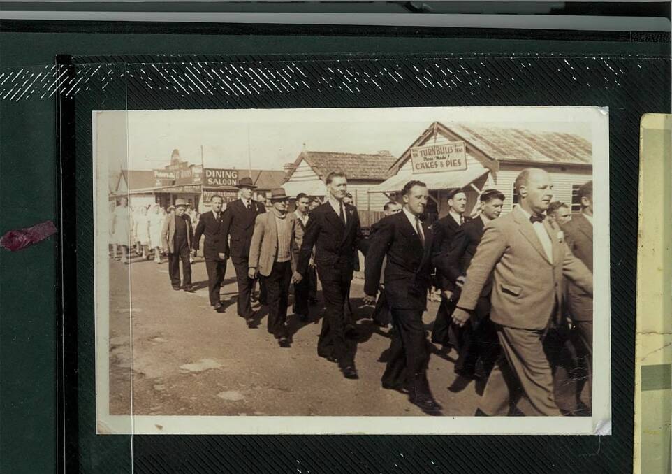 HISTORIC PHOTO: Jennifer Bevan's father 'Bill' pictured fifth from left, marching along the Princes Highway, Milton, past Turnbull's Cakes and Pies.