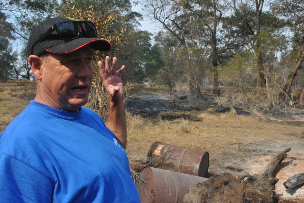 FIRST-HAND: Business owner Rick Walker describes the how the smoke affected his eyes while he, his son and his son's friends defended property nearby.