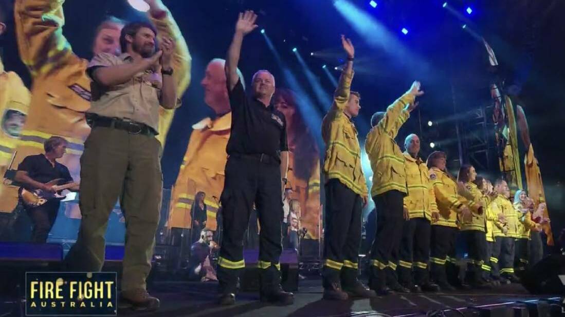  RFS members and international firefighters where cheered on stage. Picture: NSW RFS Twitter.