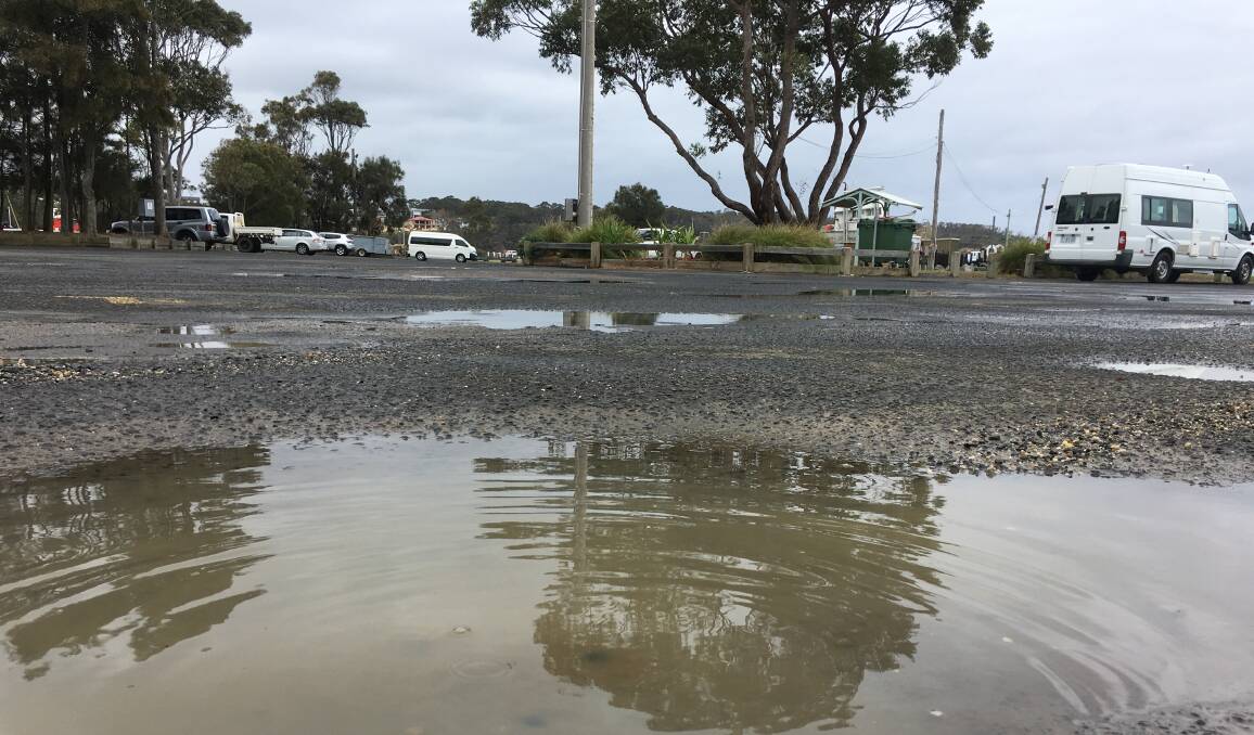 Puddles remain in the Ulladulla Harbour car park.
