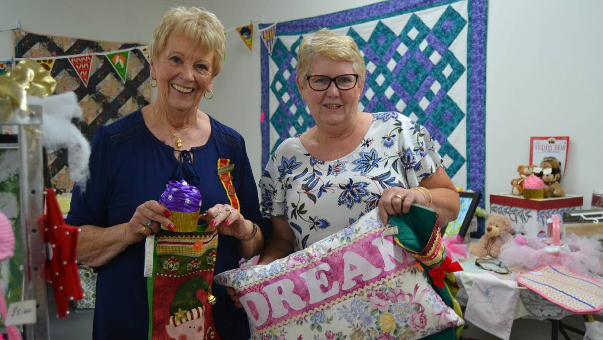 STOCKING FILLERS: Milton Ulladulla Hospital Auxiliary president Judy Bond and volunteer Julie Read with some of the many items available.