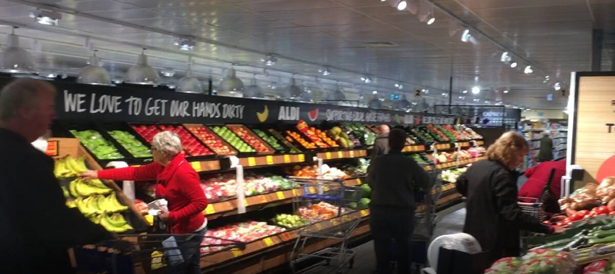 The first shoppers peruse the fresh produce aisle at the refurbished ALDI Ulladulla. 