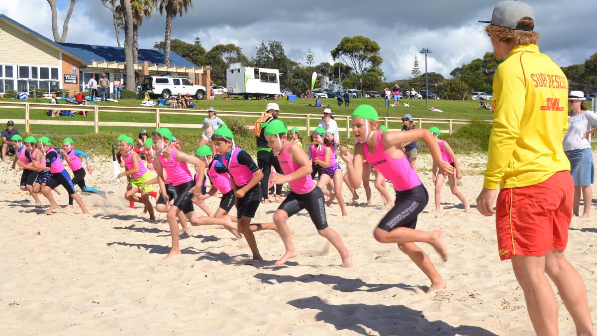 Canberra Nippers during their first session at Mollymook last year. Council has agreed to install showers in front of the clubhouse (pictured behind the nippers).
