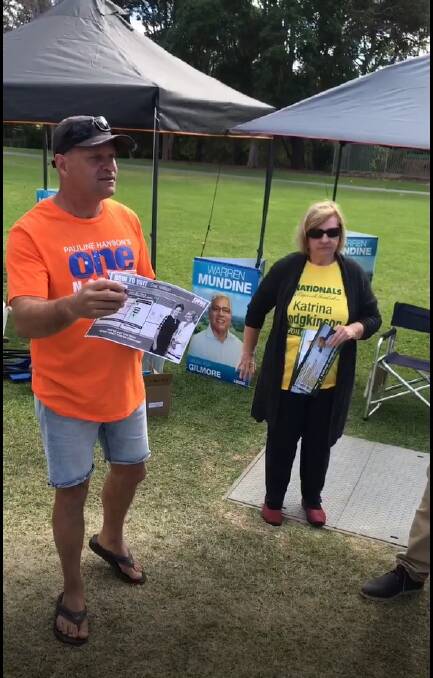 A One Nation pre-poll volunteer with the unauthorised how-to-vote card. Picture: ACTU.