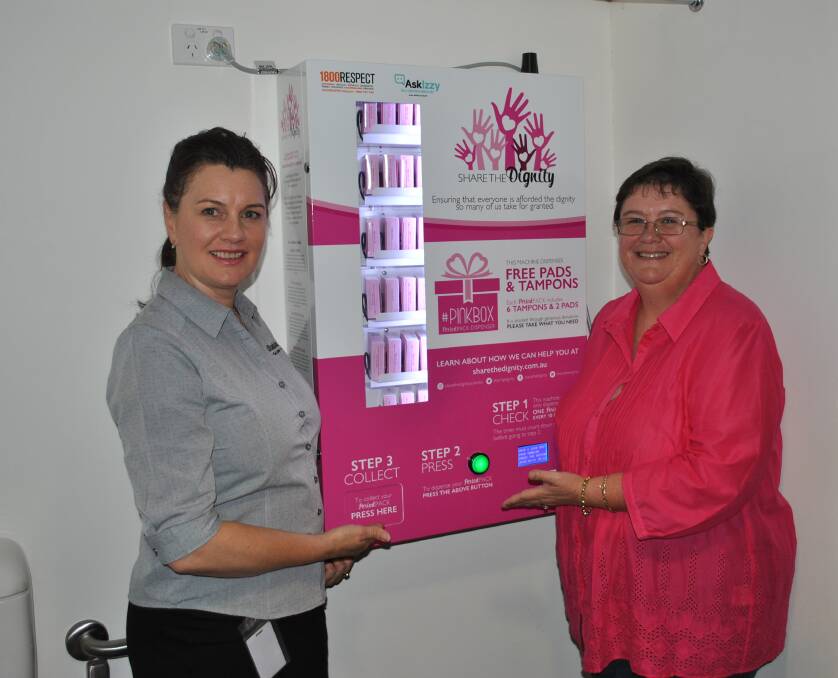 Ulladulla Civic Centre manager Michelle Babington and Share the Dignity representative Gaynor Carriage with the newly installed feminine hygiene products dispenser. 