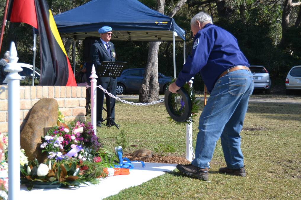 The 2018 Anzac Day service at Kioloa included the dedication of the newly-installed memorial wall.  