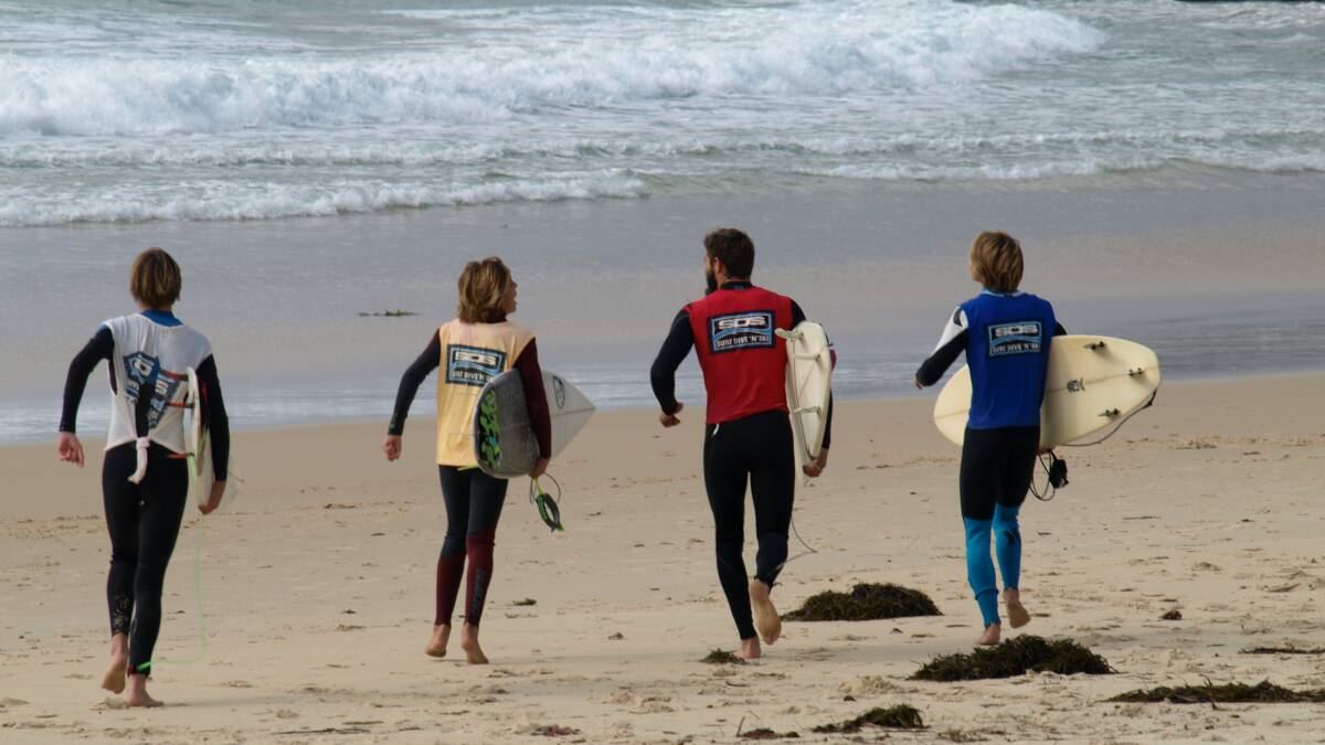 TAKING THE PLUNGE: Competitors off for their heat at a previous Christian Surfers event.