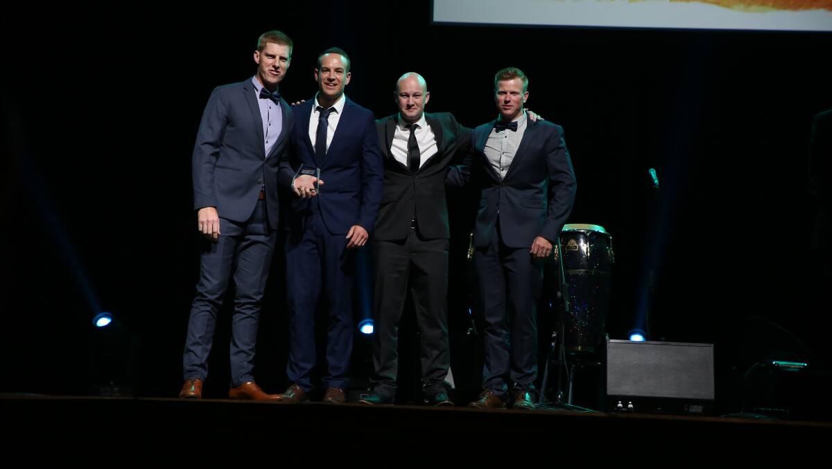 J&T Dale Plumbing's Tom Dale, Aaron Westor, Brett Ringland, Jamie Dale accept the Excellence in Small Business award. Picture: Greg Ellis/Illawarra Mercury.
