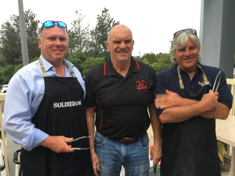 GRILL: Soldier On fundraisers Mick Crowle, Peter Still and Darryl Snow. 