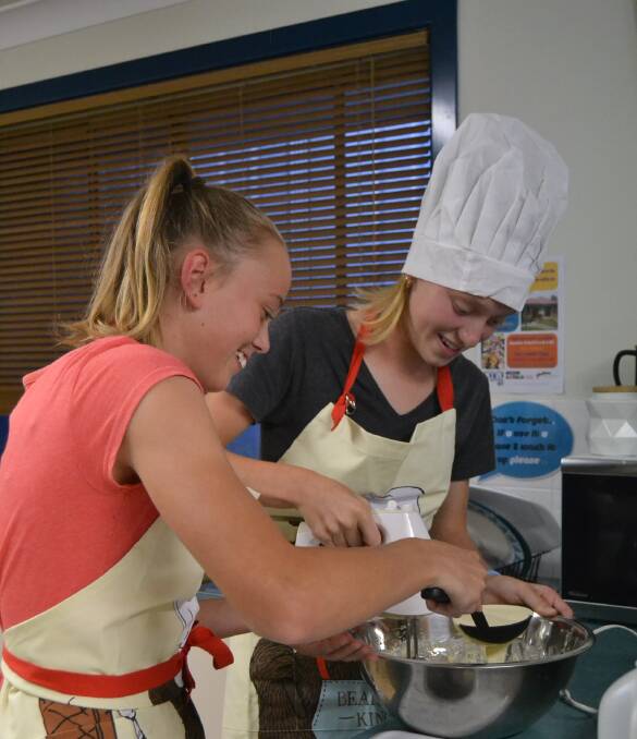 Holly and Elloise whipping up waffles for course two. 