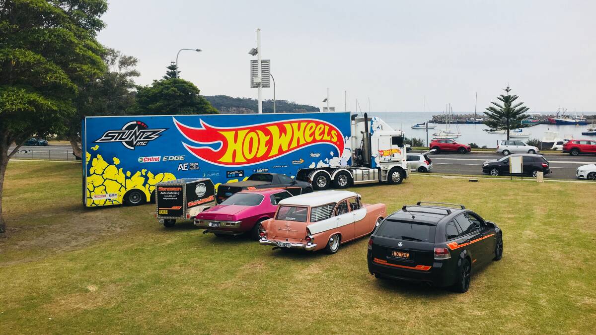 Car enthusiasts lined up for photos with the Hot Wheels truck when it was parked outside the Ulladulla Civic Centre. Picture: Anthony Rowe/supplied.
