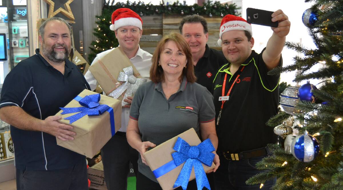 GIFT OF GIVING: Chris Kouroupakis, Chris Coffey, Julie Porter, Patrick Mallon and Craig Smith are encouraging people to give a little this Christmas. 