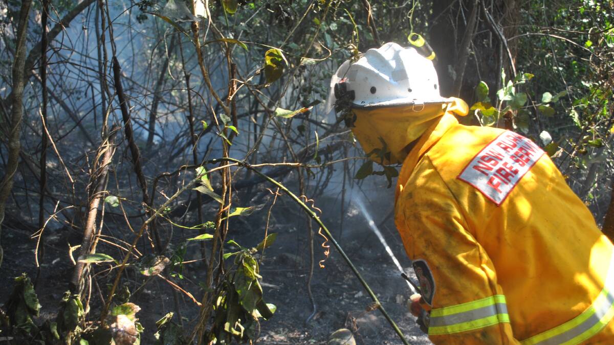 DENSE SCRUB: A team of five firefighters worked from the ground while helicopters assist controlling a spotfire.