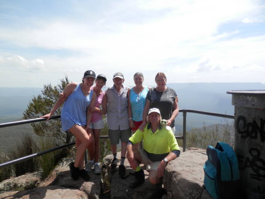 Harry Easton (centre) with daughters Karyn Alexander, Kerri Clifford-Rodda and Kara Lee, granddaughter Kimberley Alexander and son-in-law Phil Rodda at the top of Pigeon House Mountain Didthul walking track. Picture: supplied.
