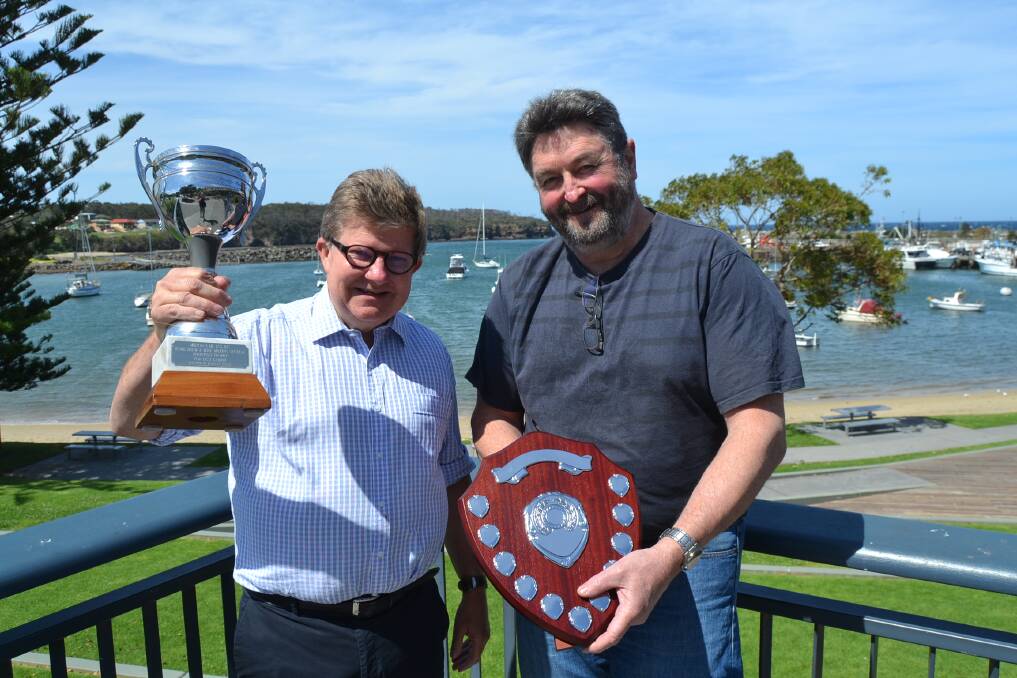 Milton Show's home brew beer, wine, liqueur and spirit competition chief steward John Hozack and judge Mitch White with the perpetual trophy and plate.