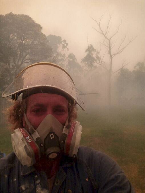 Vern Jackson took this photo as a bushfire burned out a strip of land behind his Lake Tabourie property on Thursday.