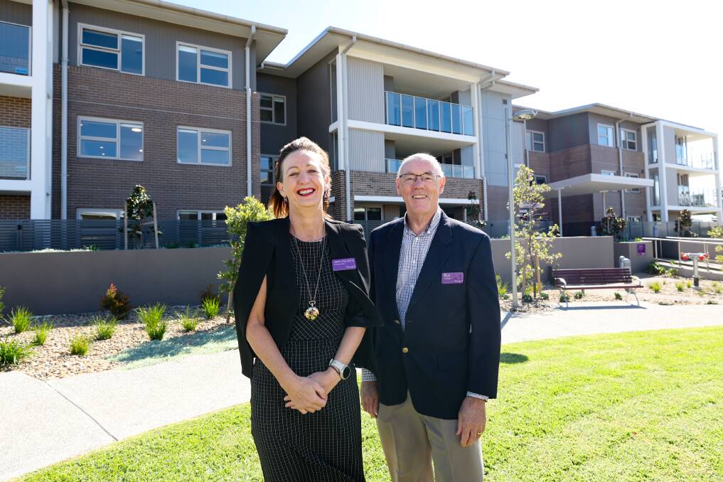 Warrigal chief executive officer Jenni Hutchins and chairman Wyn Janssen in front of the final stage of the Shell Cove village. Picture by Adam McLean