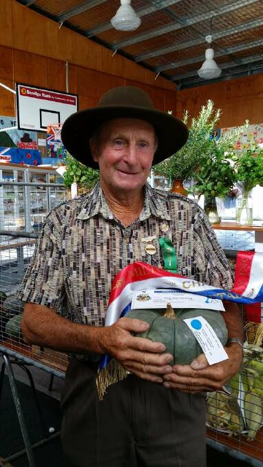 WINNER: Roy Johnston with his grand champion pumpkin.