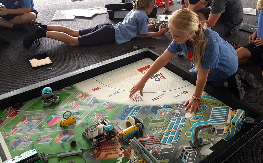 The school Lego League team are putting their STEM skills to work in beginning the initial construction and coding of their robots.
