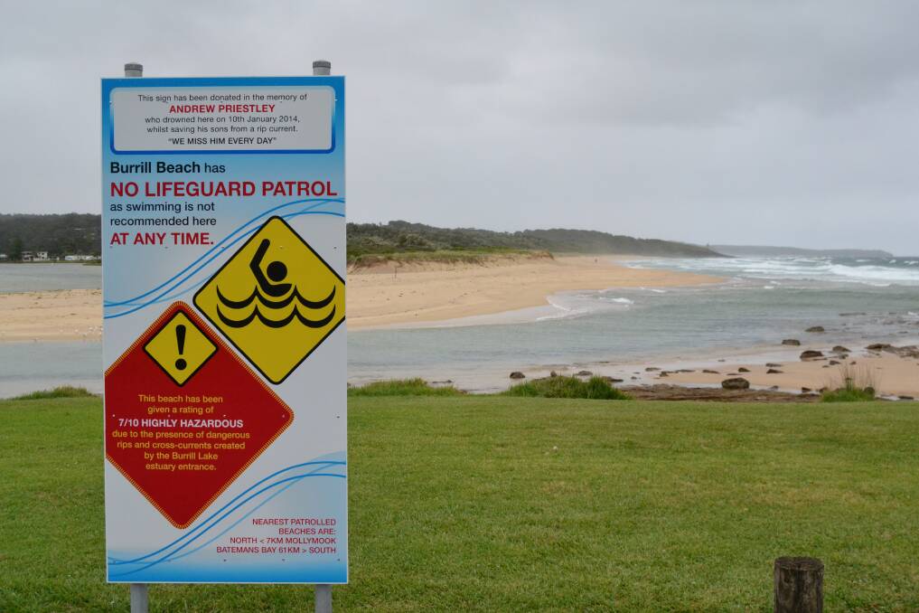 DANGER: The Priestley family donated signs to the area to discourage people from swimming at Burrill Lake after Andrew Priestley drowned trying to save his sons. 