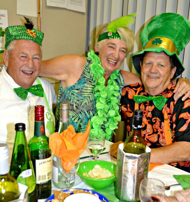 GREEN MACHINES: Brian O’Connell, Robyn Collyer and John Nelson embrace the Irish spirit at Kioloa and help  raise funds for the Kioloa-Bawley Point pathway. 