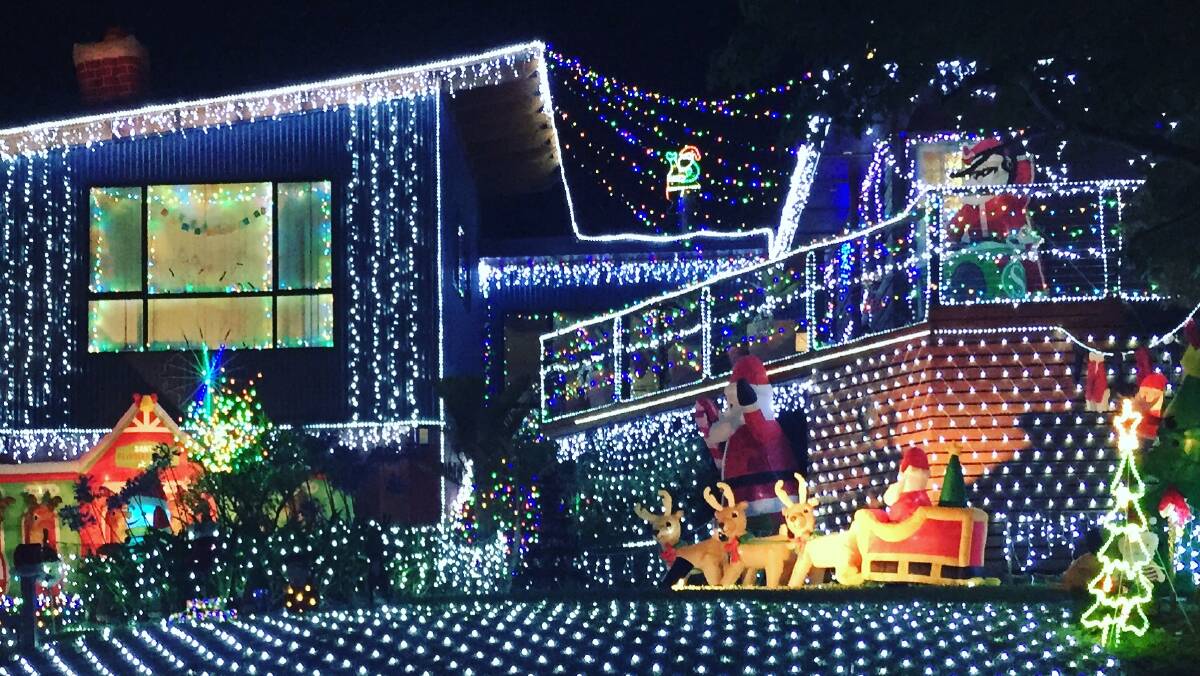 ALL ALIGHT: Mel Diver and Mark Whipp's impressive display drew plenty of attention over Christmas and raised $1800 for the Cancer Council. 