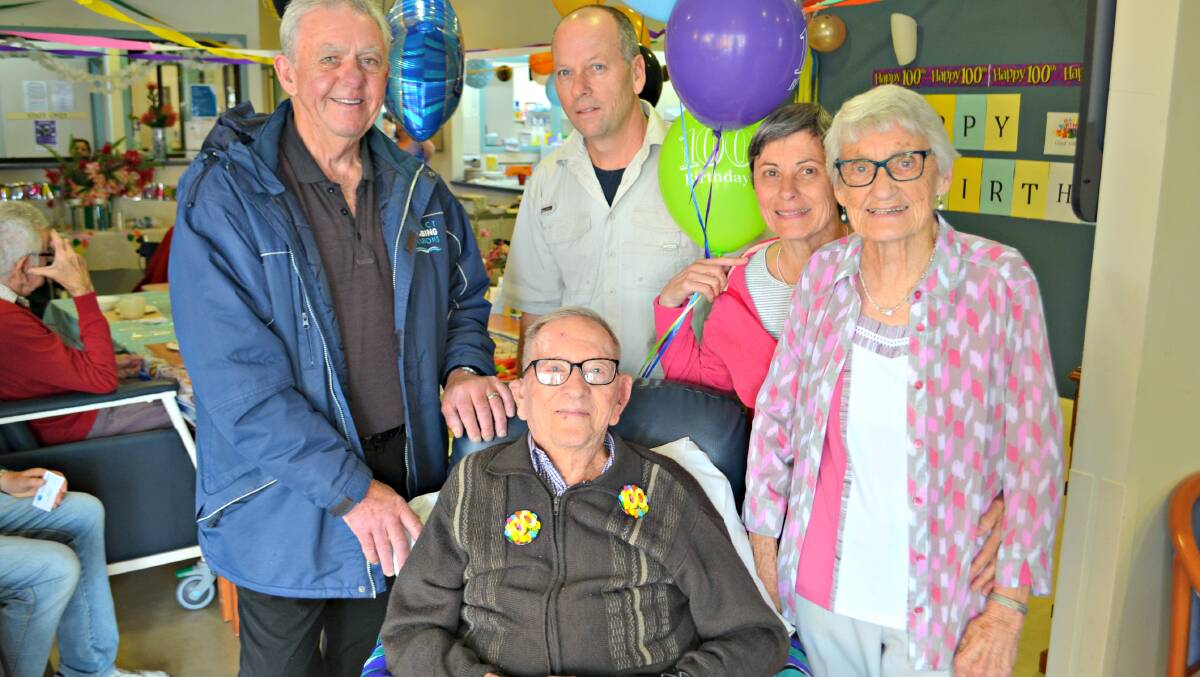 PARTY TIME: Lloyd Thomson celebrates his 100th birthday with son-in-law Neil Comerford, son Matthew Thomson, daughter Jill Comerford and wife Avis Thomson. 