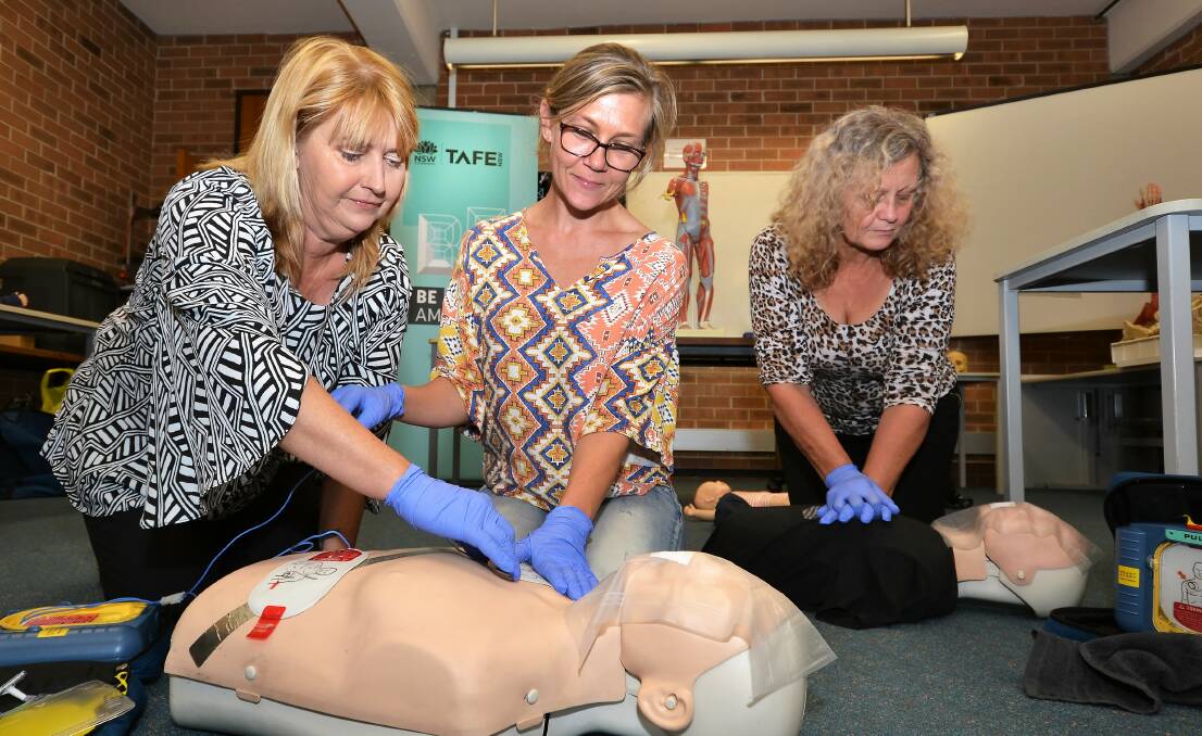 VITAL: TAFE NSW first aid teacher Georgie McInerney offers life-saving skills to student Sandra Davis.