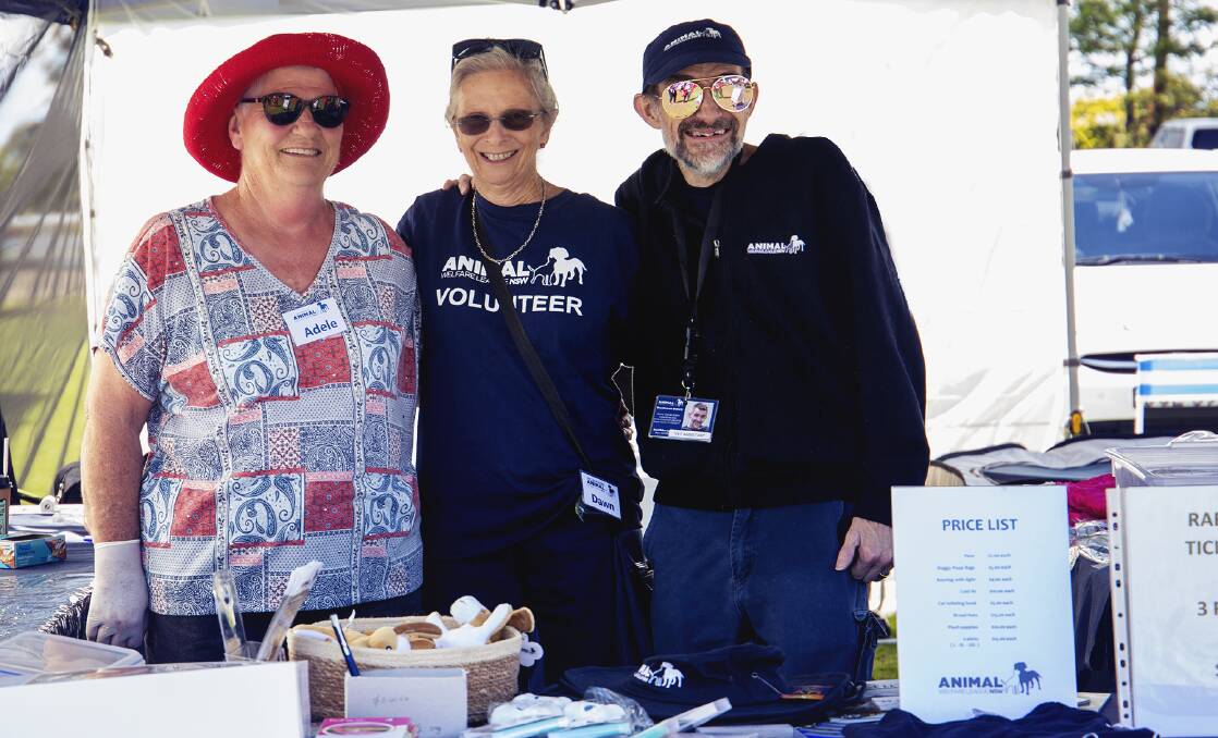 HERE'S TO 40: Shoalhaven branch of the Animal Welfare League Adele Farrant, Dawn Wilson and Daniel Aitken at the Shoalhaven Pet Expo recently. Photo: supplied. 