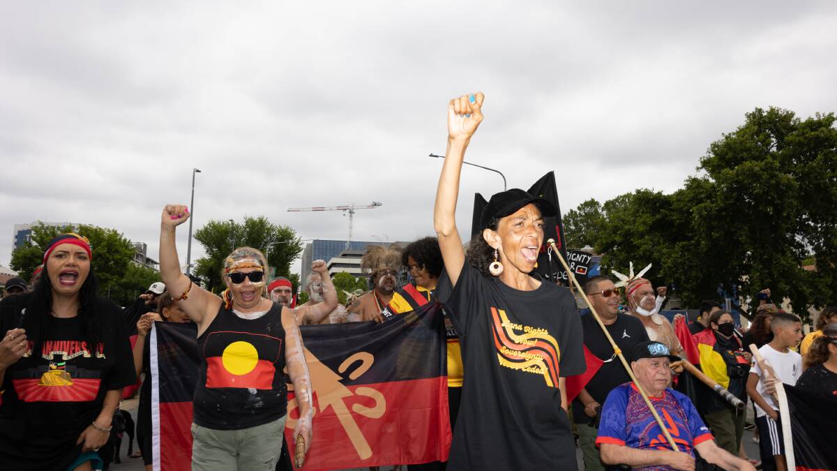 Indigenous Australians and supporters march from Garema Place to the Aboriginal Tent Embassy Wednesday. Picture: Sitthixay Ditthavong