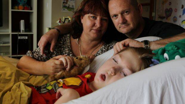 Jo-ann and Michael Morris with their son, Samuel, in 2013 when he was in palliative care at Bear Cottage in Manly. Photo: Janie Barrett
