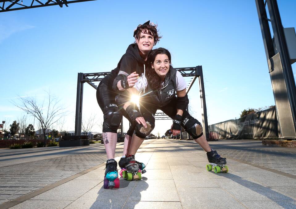 EYES ON THE PRIZE: North East Roller Derby players Lacey "Lulu" Hyland and Thelma "Vlam" Vlamis. Picture: JAMES WILTSHIRE