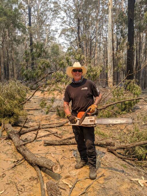 Roger Mayer has spent the day clearing fallen trees and branches from roads in fire-affected areas.