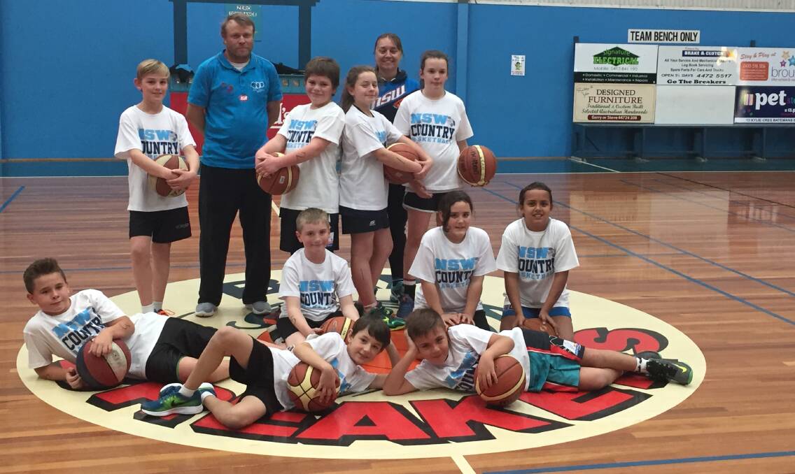 BAY SKILLS: Head coach Troy Genner and assistant coach Marnie Crabb with participants at the Under 12s Batemans Bay Basketball Skills Day. 