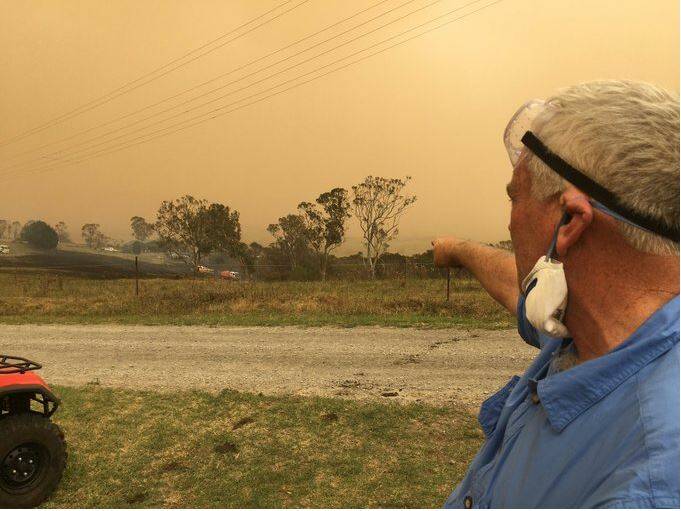 CLOSE CALL: Milton's Robert Miller points to section of the rainforest where the fire leapt from, burning towards Stony Hill Lane, on Thursday. Photo: Sam Strong.