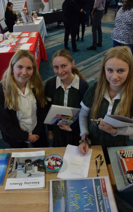 BRIGHT FUTURE: Anna Zyla, Jasmine Arndell and Emily Fletcher at the South Coast Register's careers expo stall.