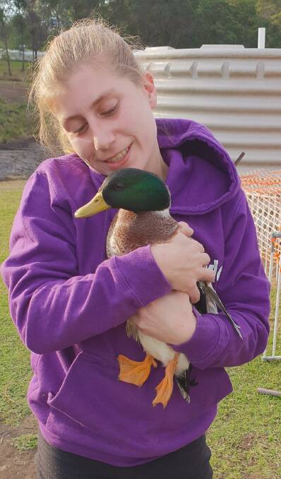 Taylor Cottington with a rescued duck.