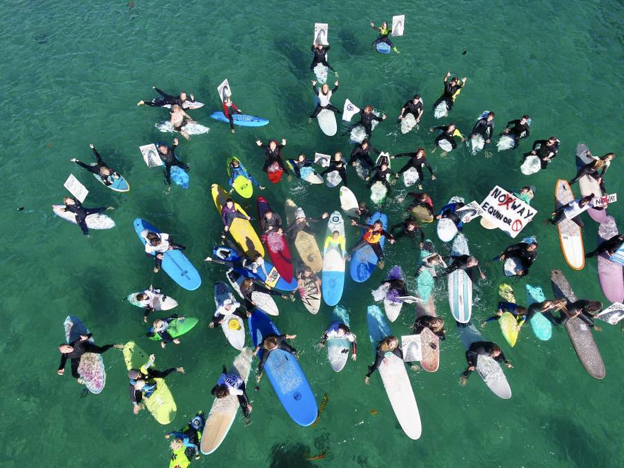 Surfers protest Equinor's plans in Kiama Harbour earlier this year.